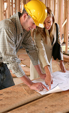 contractor looking over floor plans