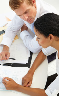 man and women reviewing documents